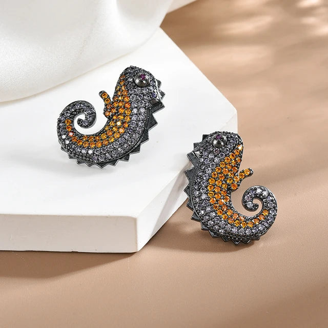 Black Metal Chameleon Studs with Orange and Grey Stones