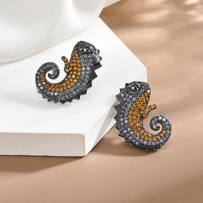 Black Metal Chameleon Studs with Orange and Grey Stones